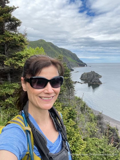 Taking a selfie with the coastal view while hiking Green Gardens Trail.