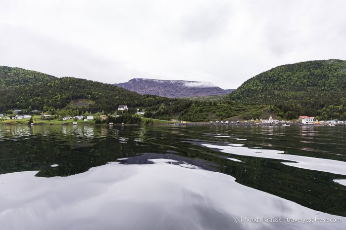 Distant view of the Tablelands from out on the water of Bonne Bay.