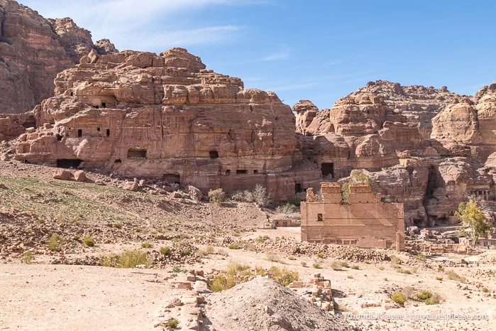 Ruined temple backed by mountains.