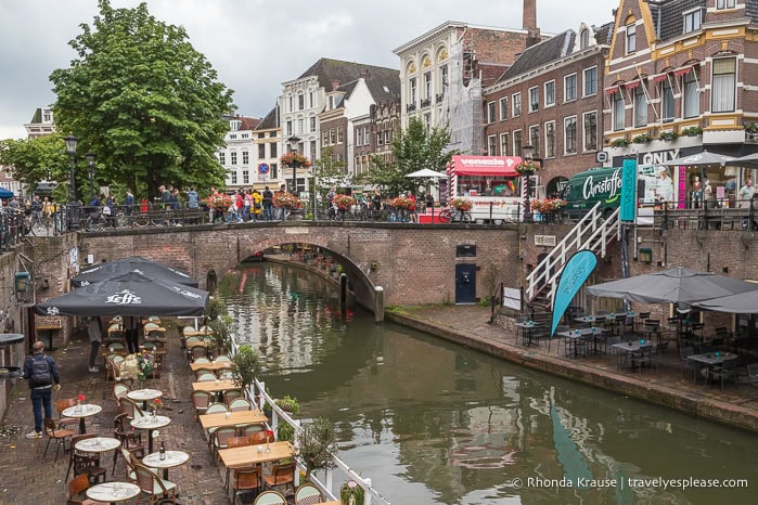 Canal with buildings and a stone bridge.