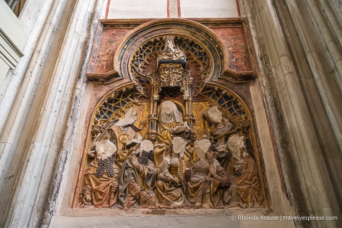 Faces broken off of a sculpted artwork in the Dom Church.