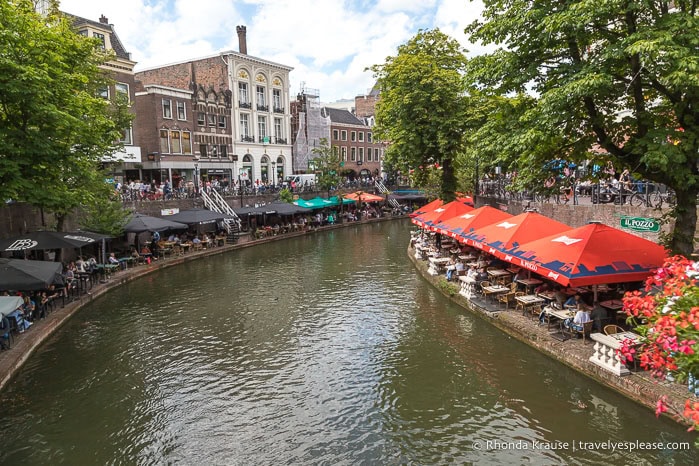 Tables and umbrellas alongside a canal in Utrecht.